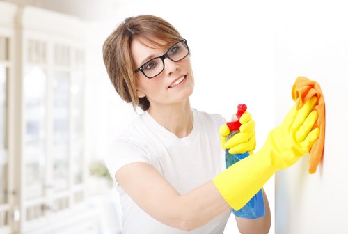 Spot cleaning a curtain stain with a soft cloth