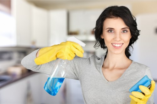 Technician treating stains during steam carpet cleaning