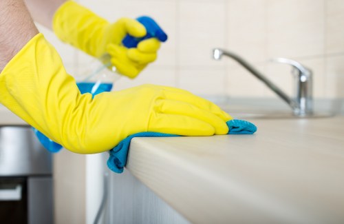 Professional upholstery cleaning equipment in use on a couch